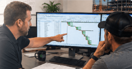 Two people reviewing a schedule together